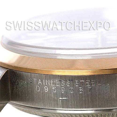 The image shows a close-up side angle of a Rolex Oyster Perpetual 14203 Men's Steel and Gold (two tone) Black Dial 14203 Men's Steel and Gold (two tone) Black Dial watch, focusing on the stainless steel case engraved with the serial number.