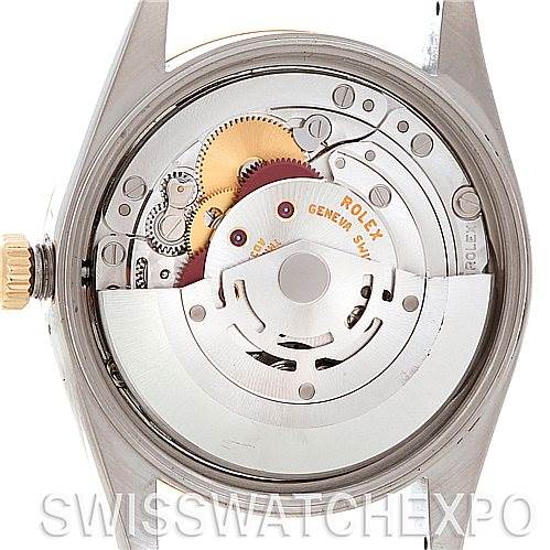 This image shows the internal mechanical components of a Rolex Oyster Perpetual 14203 Men's Steel and Gold (two tone) Black Dial 14203 Men's Steel and Gold (two tone) Black Dial watch, viewed from the case back with the rotor and gears visible.