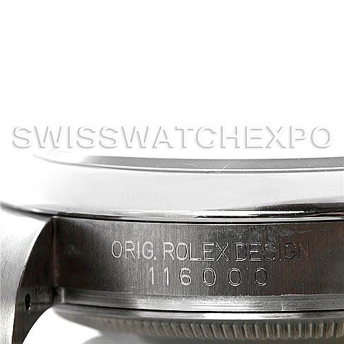 This image shows a side view of the Rolex Oyster Perpetual 116000 Men's Stainless Steel Black Dial 116000 Men's Stainless Steel Black Dial watch, displaying the model number engraved on the case.