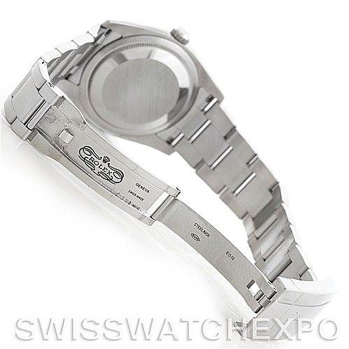 The image shows the back case and open clasp of a Rolex Oyster Perpetual 116000 Men's Stainless Steel Black Dial 116000 Men's Stainless Steel Black Dial watch from an angled rear view.