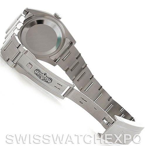 The image shows the Rolex Oyster Perpetual 116000 Men
s Stainless Steel Silver Dial 116000 Men
s Stainless Steel Silver Dial watch from the back, highlighting the case back, bracelet, and open clasp.