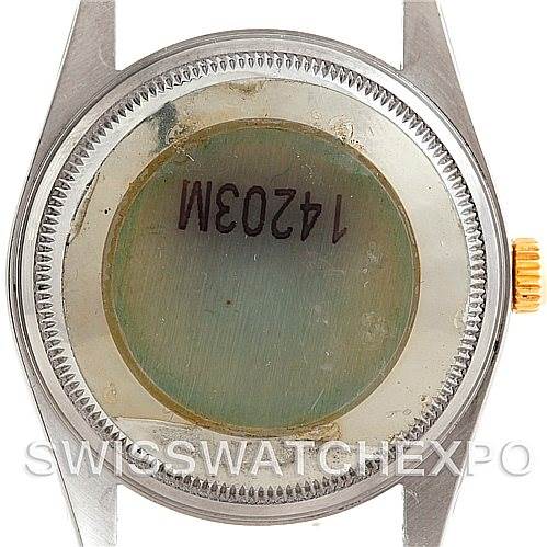 This is the back view of a Rolex Oyster Perpetual 14203 Men's Steel and Gold (two tone) Blue Dial 14203 Men's Steel and Gold (two tone) Blue Dial watch case, showing the crown and caseback.