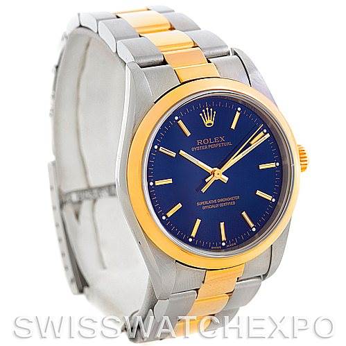 The image shows a front angle of a Rolex Oyster Perpetual 14203 Men's Steel and Gold (two tone) Blue Dial 14203 Men's Steel and Gold (two tone) Blue Dial watch, highlighting its blue dial, gold bezel, and silver and gold bracelet.