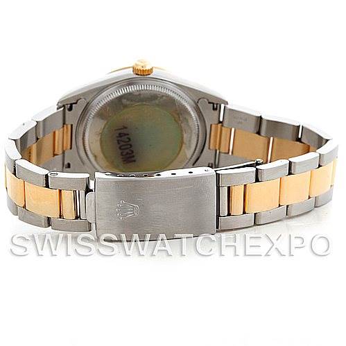 The image shows the back and bracelet of a Rolex Oyster Perpetual 14203 Men's Steel and Gold (two tone) Blue Dial 14203 Men's Steel and Gold (two tone) Blue Dial watch with a two-tone metal design.