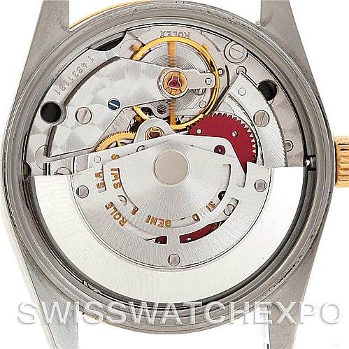 This image shows the back view of the Rolex Oyster Perpetual 14233 Men's Steel and Gold (two tone) Black Dial 14233 Men's Steel and Gold (two tone) Black Dial watch, highlighting its intricate movement and inner mechanisms.