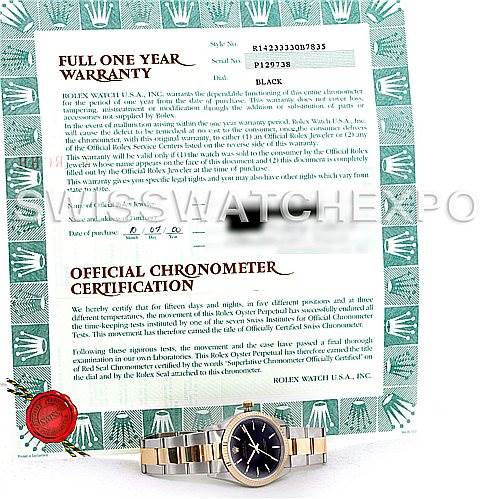 The image shows a Rolex Oyster Perpetual 14233 Men's Steel and Gold (two tone) Black Dial 14233 Men's Steel and Gold (two tone) Black Dial watch lying flat and part of its certification and warranty documents.