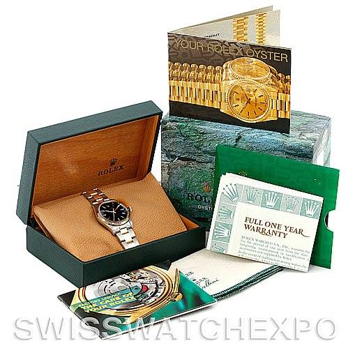 The image shows a Rolex Oyster Perpetual 14233 Men's Steel and Gold (two tone) Black Dial 14233 Men's Steel and Gold (two tone) Black Dial watch in its box, accompanied by manuals, a warranty card, and additional packaging.