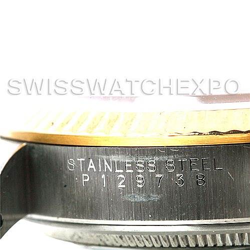 This close-up shows the side engraving and bezel of the Rolex Oyster Perpetual 14233 Men's Steel and Gold (two tone) Black Dial 14233 Men's Steel and Gold (two tone) Black Dial watch in stainless steel.