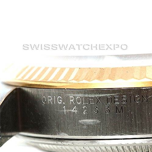 This image shows a close-up side view of the casing and bezel of a Rolex Oyster Perpetual 14233 Men's Steel and Gold (two tone) Silver Dial 14233 Men's Steel and Gold (two tone) Silver Dial watch, highlighting the inscription.