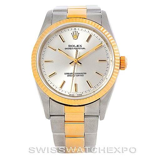 This image shows a front view of a Rolex Oyster Perpetual 14233 Men's Steel and Gold (two tone) Silver Dial 14233 Men's Steel and Gold (two tone) Silver Dial watch, highlighting the dial, bezel, crown, and part of the bracelet.
