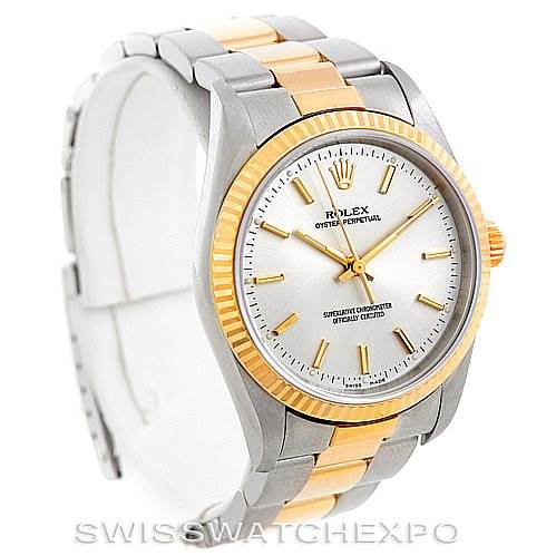 The image shows a front and slightly angled view of the Rolex Oyster Perpetual 14233 Men's Steel and Gold (two tone) Silver Dial 14233 Men's Steel and Gold (two tone) Silver Dial watch, highlighting the dial, bezel, and bracelet.
