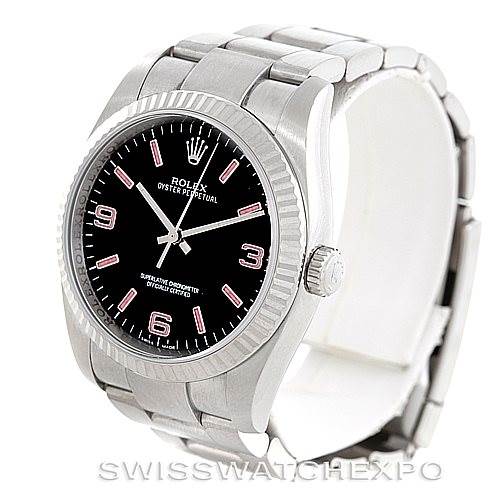 The Rolex Oyster Perpetual 116034 Men's Stainless Steel Black Dial 116034 Men's Stainless Steel Black Dial watch is shown at an oblique angle, displaying the face, bezel, crown, and bracelet.