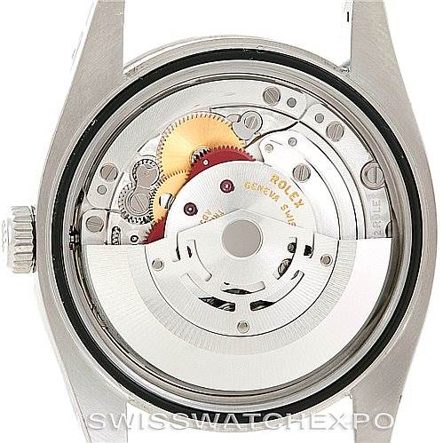 This image shows a close-up of the movement and inner mechanisms of a Rolex Oyster Perpetual 116034 Men's Stainless Steel Black Dial 116034 Men's Stainless Steel Black Dial watch.