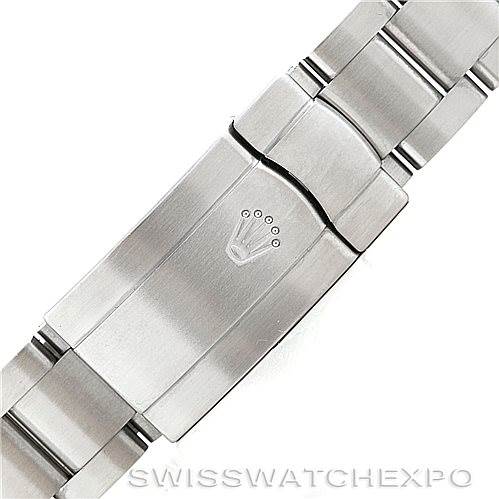 The image shows the clasp of a Rolex Oyster Perpetual 116034 Men's Stainless Steel Black Dial 116034 Men's Stainless Steel Black Dial watch bracelet, displaying the Rolex logo.