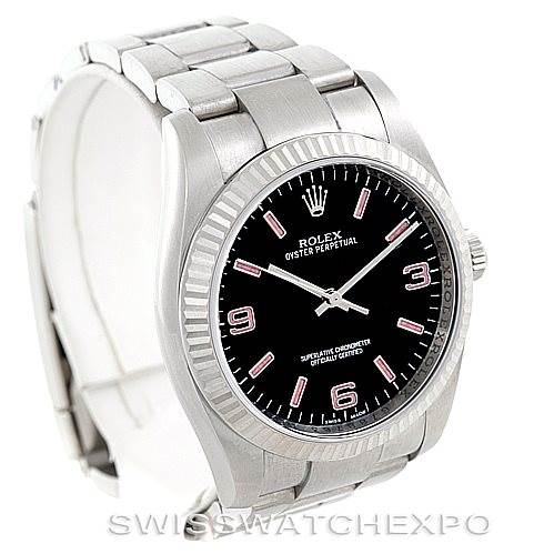 The Rolex Oyster Perpetual 116034 Men's Stainless Steel Black Dial 116034 Men's Stainless Steel Black Dial watch is shown from a slightly angled top view, displaying the dial, bezel, and part of the bracelet.