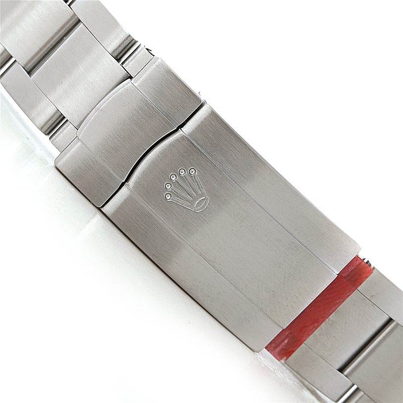 The image shows a close-up of the clasp and bracelet of a Rolex Oyster Perpetual 116034 Men's Stainless Steel Blue Dial 116034 Men's Stainless Steel Blue Dial watch.