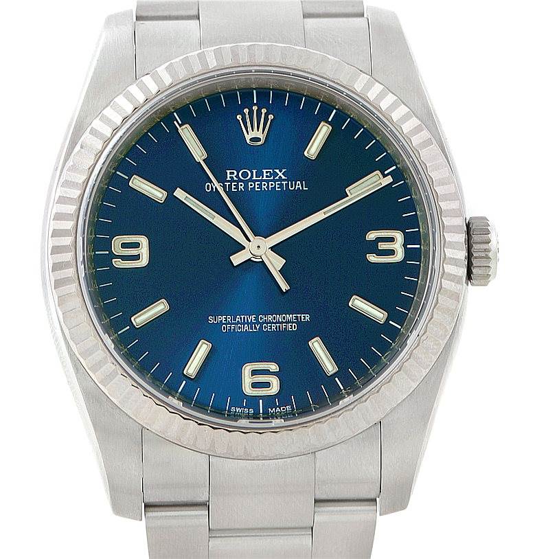 The image shows a frontal view of a Rolex Oyster Perpetual 116034 Men's Stainless Steel Blue Dial 116034 Men's Stainless Steel Blue Dial watch displaying the face and part of the bracelet.