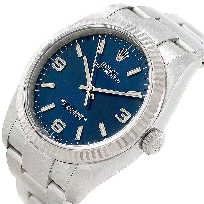 This image shows a top-angle view of an Oyster Perpetual Rolex watch, highlighting the face, bezel, crown, and part of the bracelet.