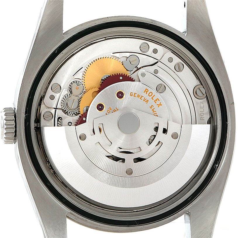 This image shows the internal mechanism of a Rolex Oyster Perpetual 116034 Men
s Stainless Steel Black Dial 116034 Men
s Stainless Steel Black Dial watch from a back angle with the case removed.