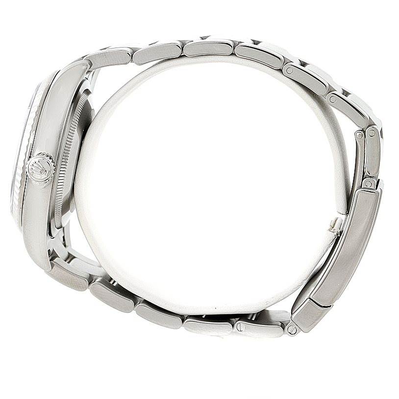 This image shows a side view of a Rolex Oyster Perpetual 116034 Men
s Stainless Steel Black Dial 116034 Men
s Stainless Steel Black Dial watch, highlighting the crown and bracelet links.