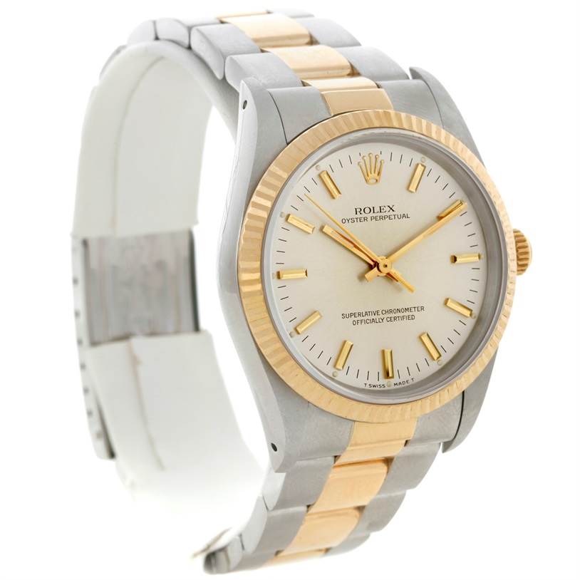 The image shows a Rolex Oyster Perpetual 14233 Men's Steel and Gold (two tone) Silver Dial 14233 Men's Steel and Gold (two tone) Silver Dial watch at a slight angle, highlighting the face, bezel, and part of the two-tone bracelet.