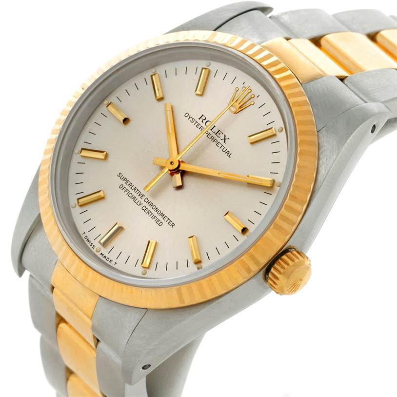 The image shows a close-up view of a Rolex Oyster Perpetual 14233 Men's Steel and Gold (two tone) Silver Dial 14233 Men's Steel and Gold (two tone) Silver Dial watch displaying its face, bezel, and part of the bracelet.