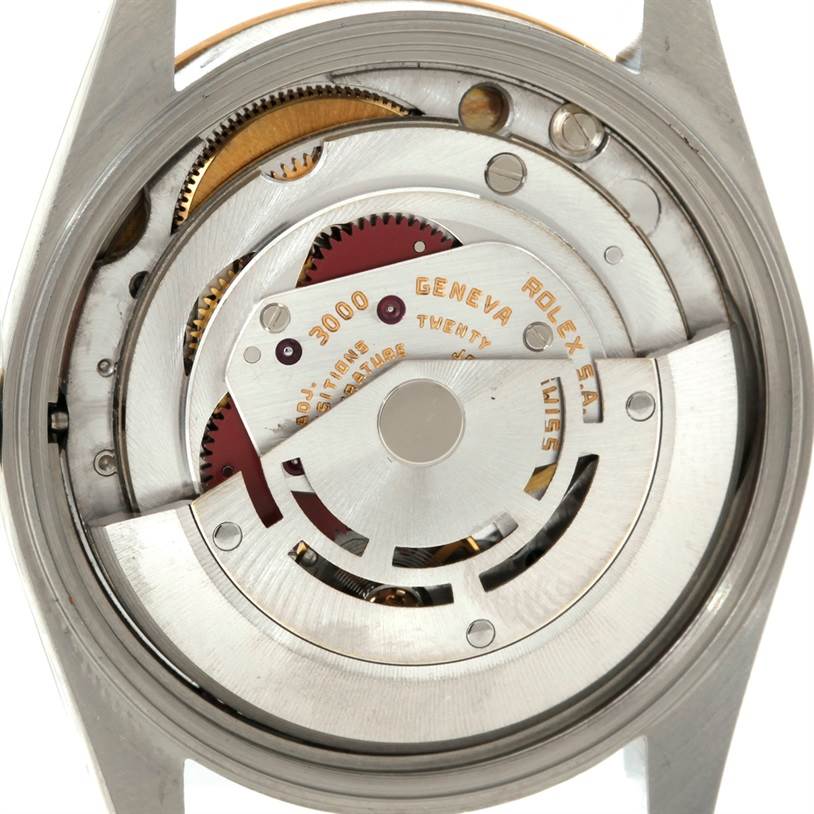This image shows the internal mechanism of a Rolex Oyster Perpetual 14233 Men's Steel and Gold (two tone) Silver Dial 14233 Men's Steel and Gold (two tone) Silver Dial watch from the back.