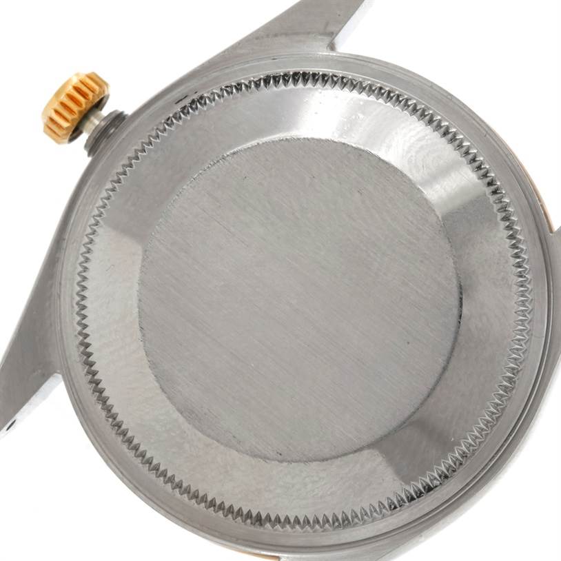 The image shows the case back and crown of a Rolex Oyster Perpetual 14233 Men's Steel and Gold (two tone) Silver Dial 14233 Men's Steel and Gold (two tone) Silver Dial watch from a top-down angle.