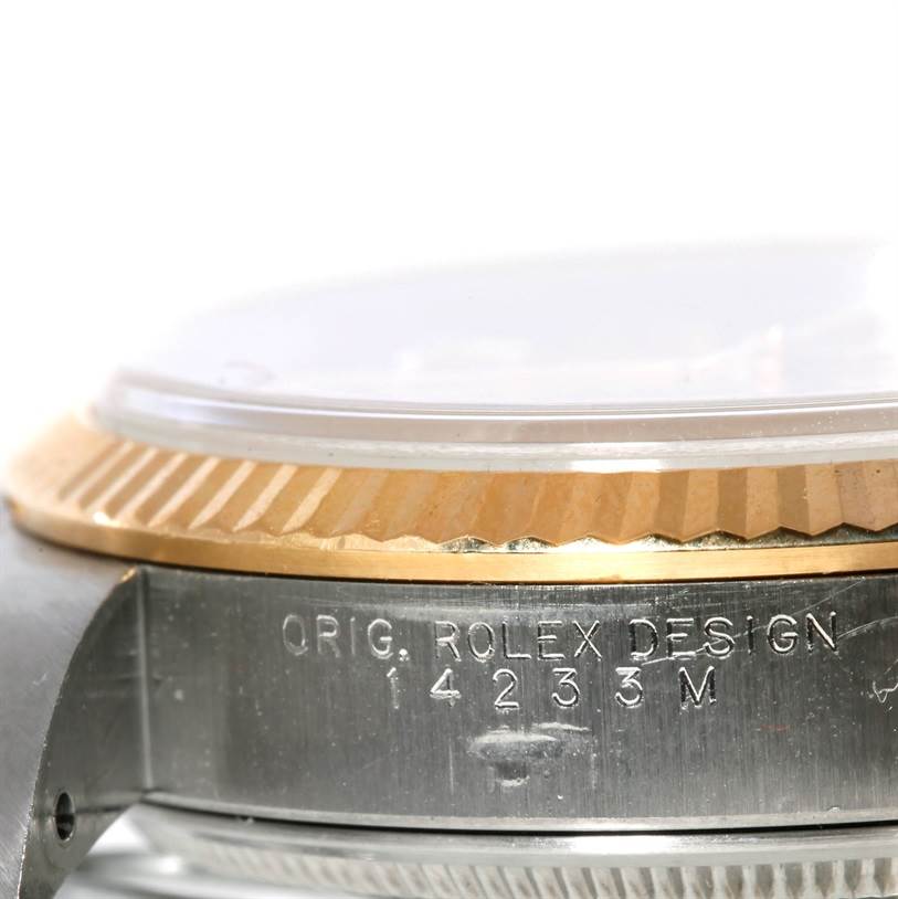 The image shows a close-up side view of the bezel and case of a Rolex Oyster Perpetual 14233 Men's Steel and Gold (two tone) Champagne Dial 14233 Men's Steel and Gold (two tone) Champagne Dial watch, including the engravings on the side.