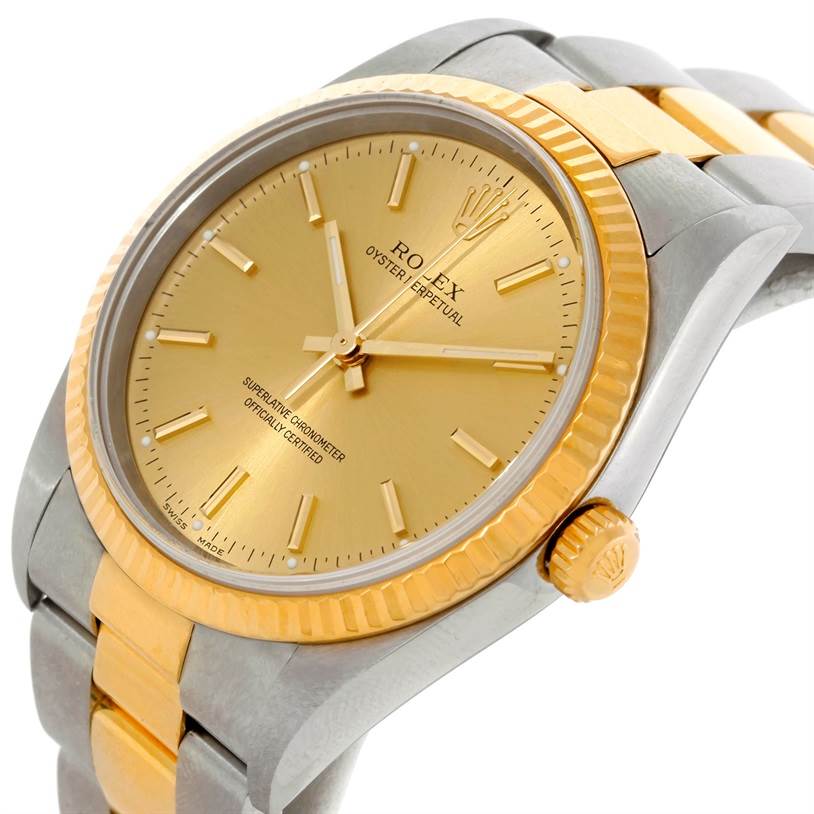 The image shows a close-up angle of the Rolex Oyster Perpetual 14233 Men's Steel and Gold (two tone) Champagne Dial 14233 Men's Steel and Gold (two tone) Champagne Dial watch, highlighting the gold dial, bezel, and two-tone bracelet.