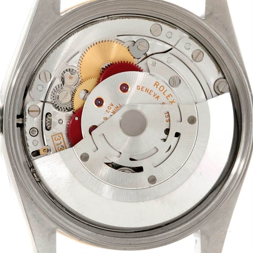 The image shows the open case back and movement mechanism of a Rolex Oyster Perpetual 14233 Men's Steel and Gold (two tone) Champagne Dial 14233 Men's Steel and Gold (two tone) Champagne Dial watch.