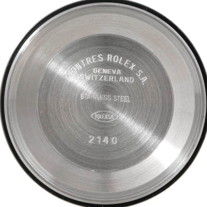 This is the interior back cover of a Rolex Oyster Perpetual 14233 Men's Steel and Gold (two tone) Champagne Dial 14233 Men's Steel and Gold (two tone) Champagne Dial watch, showing inscriptions and serial numbers.