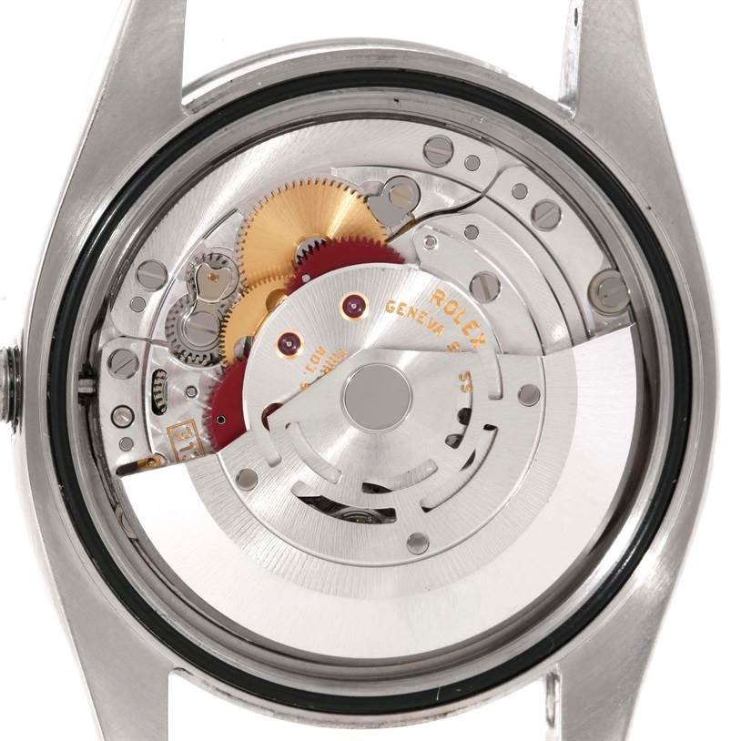 This image shows the movement mechanism of a Rolex Oyster Perpetual 116000 Men's Stainless Steel Silver Dial 116000 Men's Stainless Steel Silver Dial model from the back case angle.