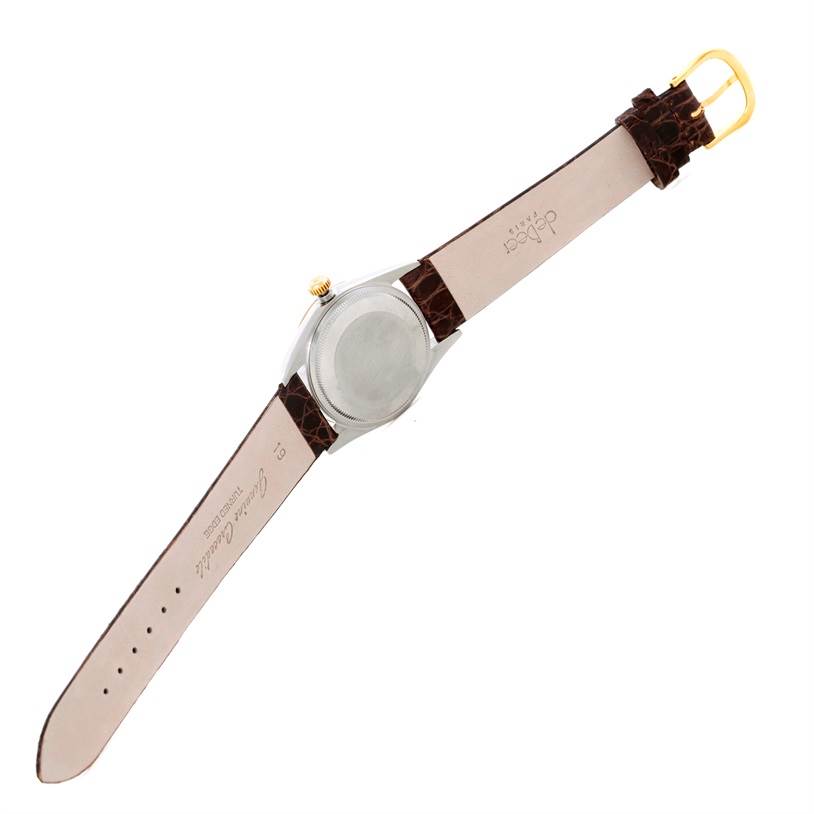 The image shows the back view of a Rolex Oyster Perpetual 14203 Men
s Steel and Gold (two tone) Grey Dial 14203 Men
s Steel and Gold (two tone) Grey Dial watch with its strap fully extended.