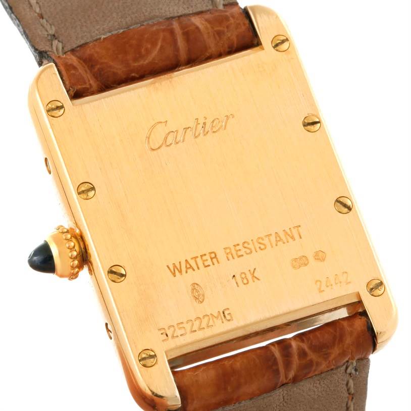 The image shows the back view of the Cartier Tank Louis W1529856 Women's Yellow Gold Silver Dial W1529856 Women's Yellow Gold Silver Dial watch, highlighting its 18K gold casing and water resistance feature.