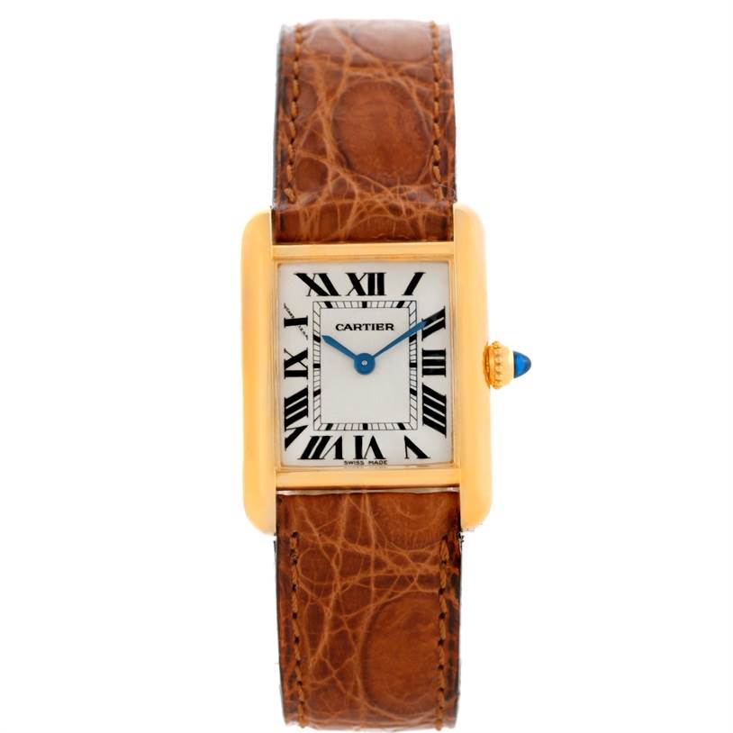 The image shows a front view of the Tank Louis watch by Cartier, highlighting its brown leather strap and rectangular dial.