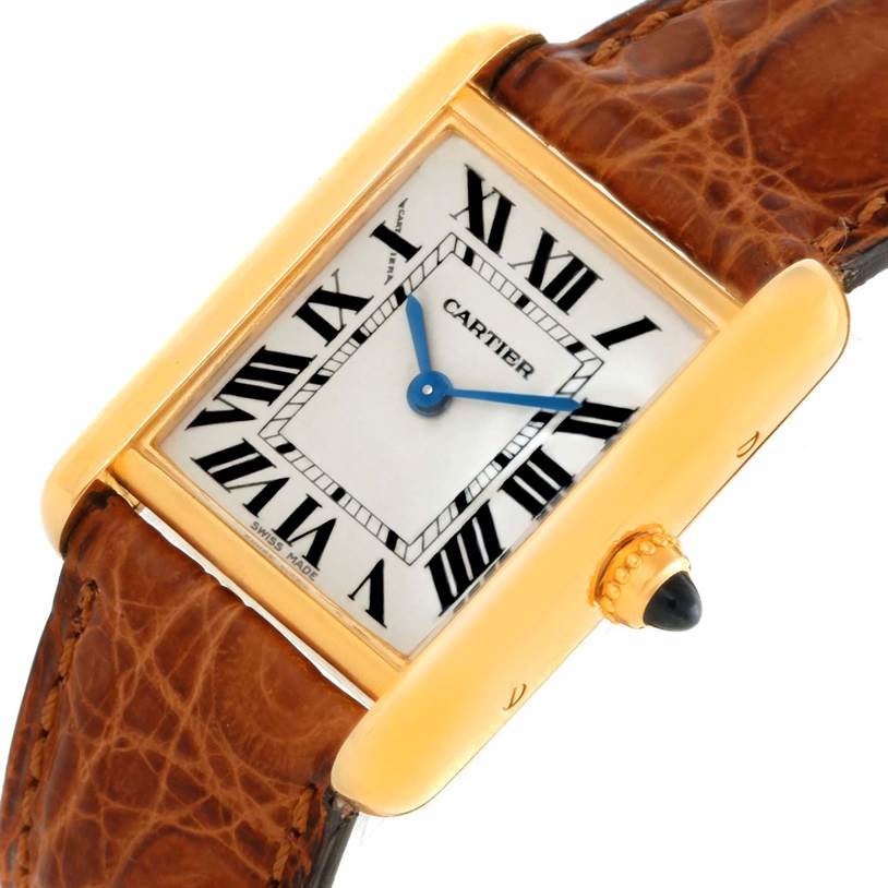 The image shows a close-up, angled view of the Cartier Tank Louis W1529856 Women's Yellow Gold Silver Dial W1529856 Women's Yellow Gold Silver Dial watch, highlighting its face, crown, and leather strap.