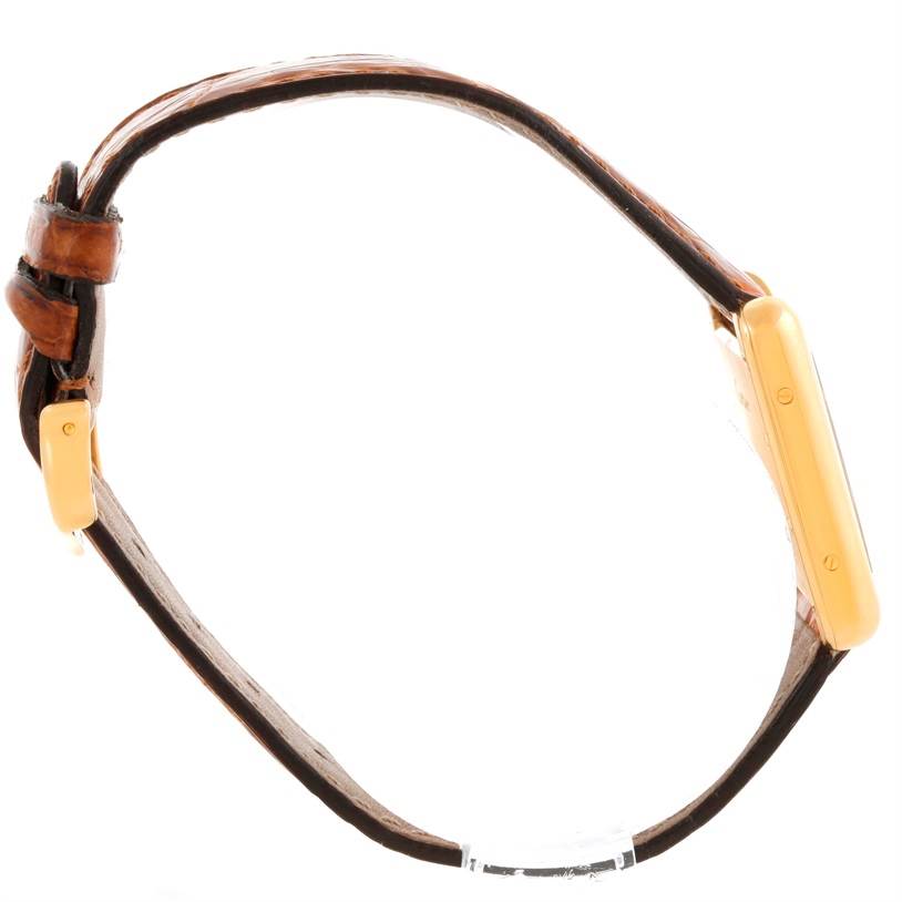 This side-angle image shows the strap and side view of the case of a Cartier Tank Louis W1529856 Women's Yellow Gold Silver Dial W1529856 Women's Yellow Gold Silver Dial watch.