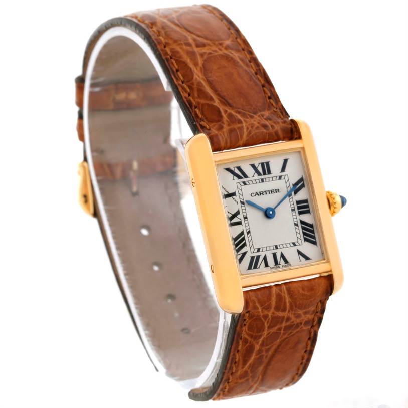 This image shows a Cartier Tank Louis W1529856 Women's Yellow Gold Silver Dial W1529856 Women's Yellow Gold Silver Dial watch at a slight angle, highlighting the face, brown leather strap, and gold casing.