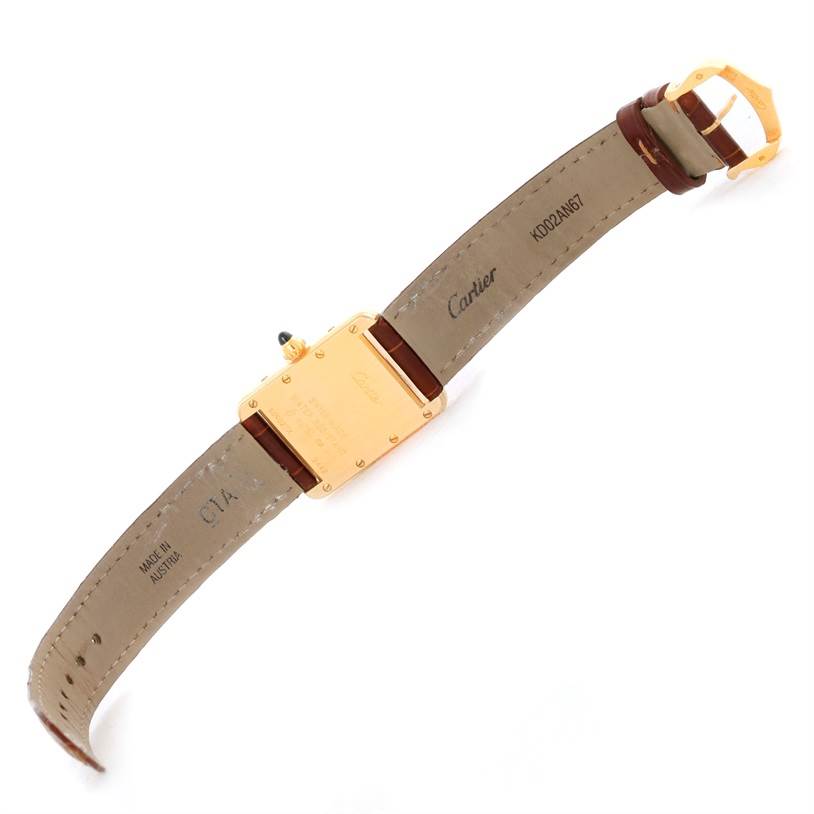 The image shows the back of a Cartier Tank Louis W1529856 Women's Yellow Gold Silver Dial W1529856 Women's Yellow Gold Silver Dial watch, displaying the case back and leather strap with buckle.