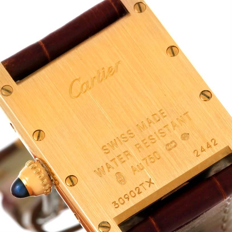 This image shows the back case and crown of the Cartier Tank Louis W1529856 Women's Yellow Gold Silver Dial W1529856 Women's Yellow Gold Silver Dial watch in close-up.