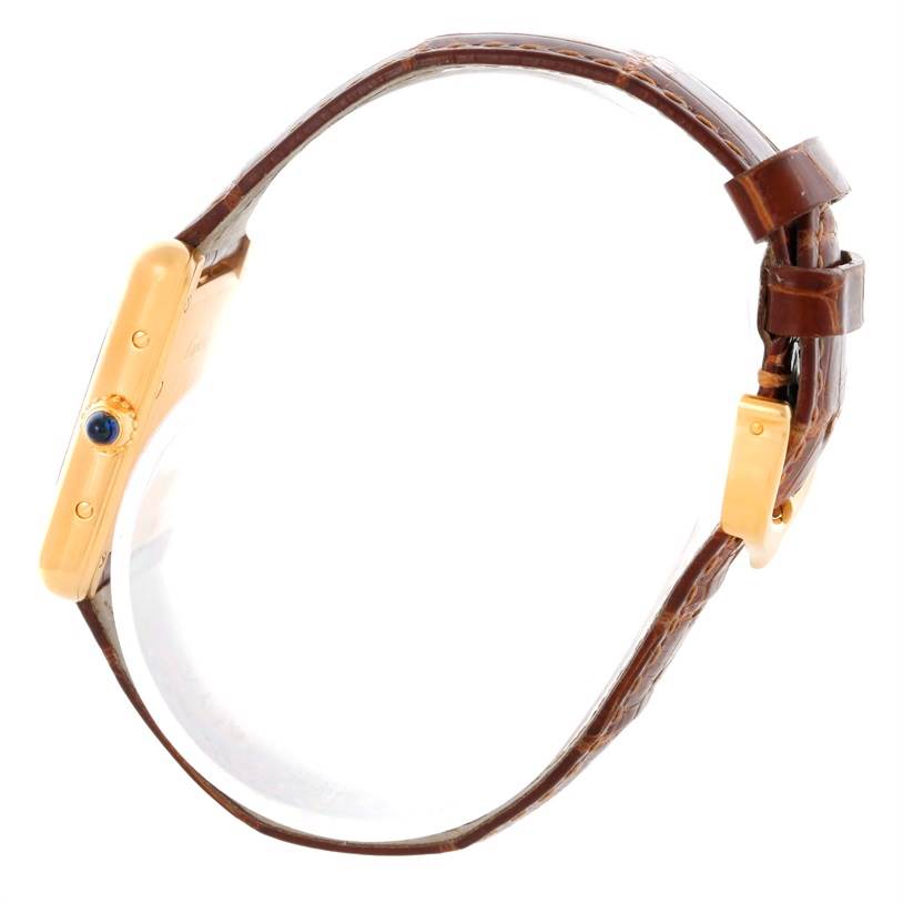 This image shows a side view of the Cartier Tank Louis W1529856 Women's Yellow Gold Silver Dial W1529856 Women's Yellow Gold Silver Dial watch, highlighting its profile, crown, and leather strap.