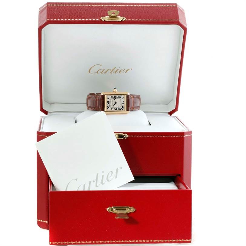 The image shows a Cartier Tank Louis W1529856 Women's Yellow Gold Silver Dial W1529856 Women's Yellow Gold Silver Dial watch, displayed within an open red case with a booklet.