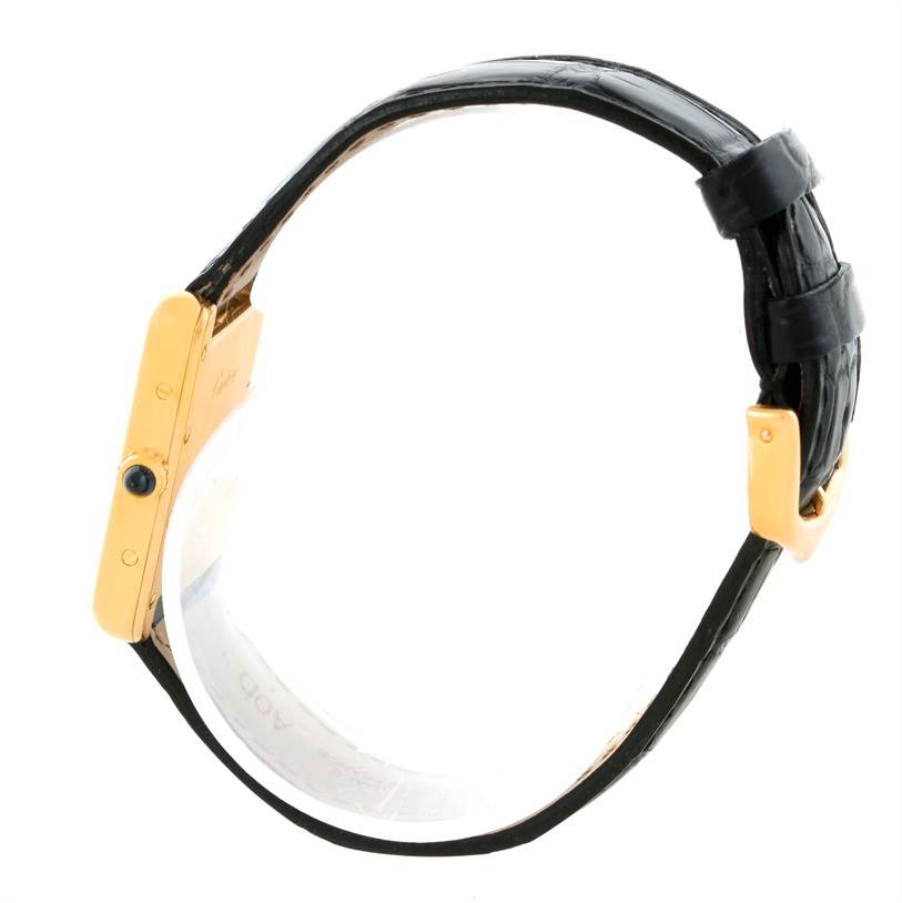 The image shows a Cartier Tank Louis W1529856 Women's Yellow Gold Silver Dial W1529856 Women's Yellow Gold Silver Dial watch from a side angle, featuring its case, crown, and black leather strap.