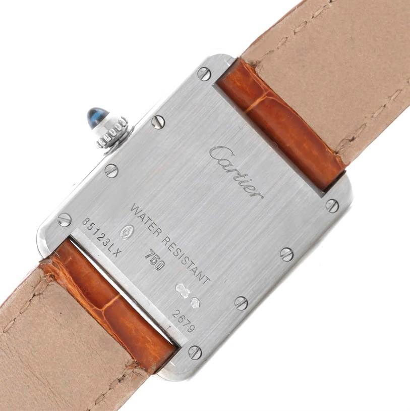 The image shows the back view of a Tank Louis watch by Cartier, highlighting the case back and leather strap.