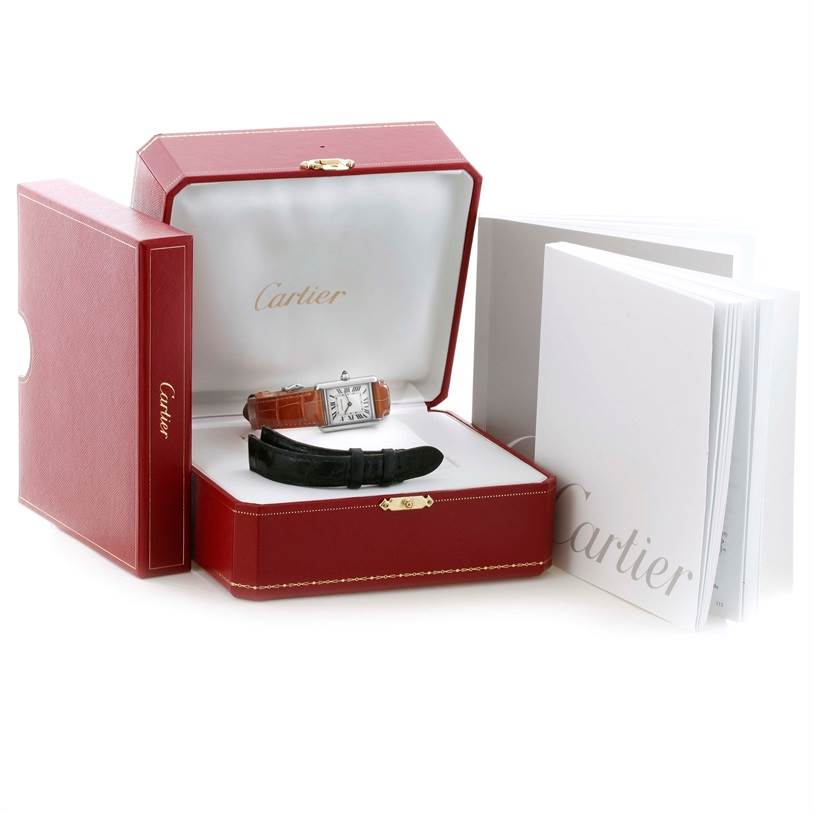 The image shows a Cartier Tank Louis W154105 Women's White Gold Silver Dial W154105 Women's White Gold Silver Dial watch at a slight angle with its box, an extra strap, and accompanying documentation.