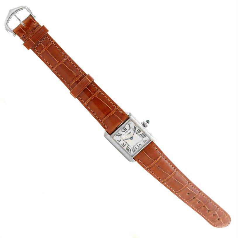 The image shows a Cartier Tank Louis W154105 Women's White Gold Silver Dial W154105 Women's White Gold Silver Dial watch from a top-down angle, displaying its face, silver case, and brown leather strap.