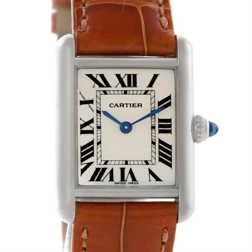 The image shows a Tank Louis model watch by Cartier, featuring the face, bezel, and part of the brown leather strap.