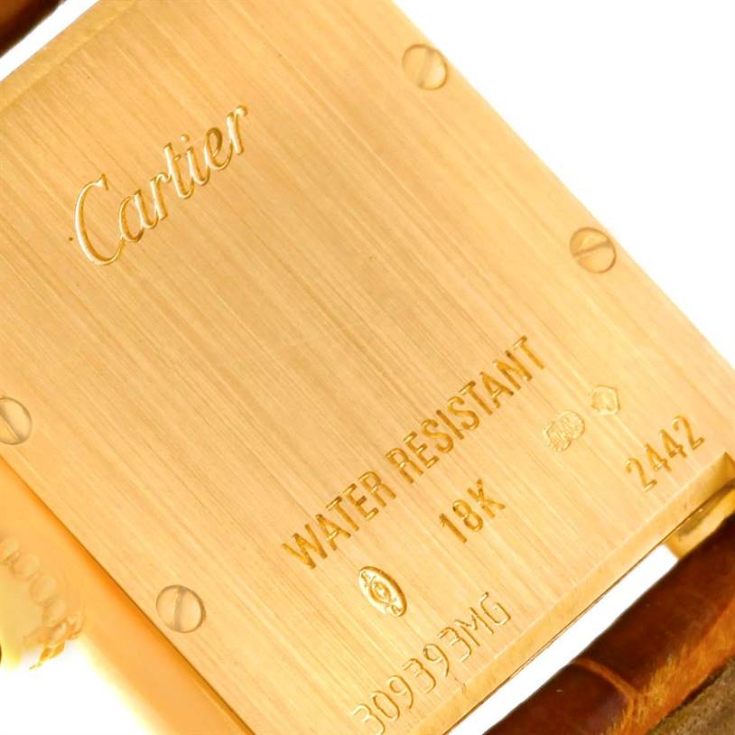 This is a close-up of the back of a Cartier Tank Louis W1529856 Women's Yellow Gold Silver Dial W1529856 Women's Yellow Gold Silver Dial watch, showing the gold casing, branding, and water resistance marking.