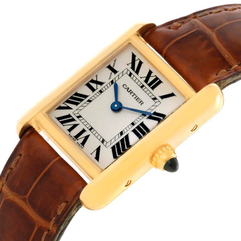 The image shows a Tank Louis model by Cartier from an angled top view, displaying the face, dial, case, crown, and brown leather strap.